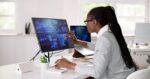 Lady utilizing Power BI on computer